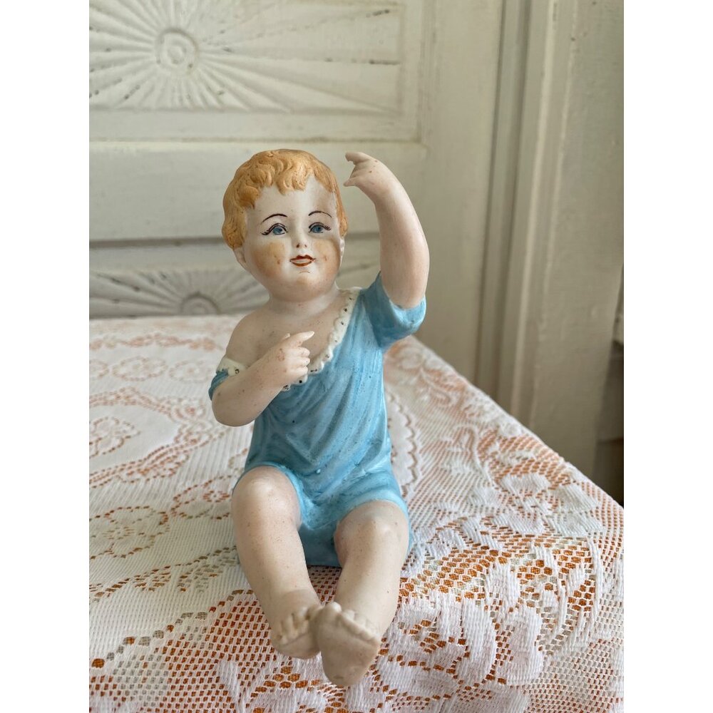 Antique German Bisque Porcelain sitting Piano Baby Figurine 5.5